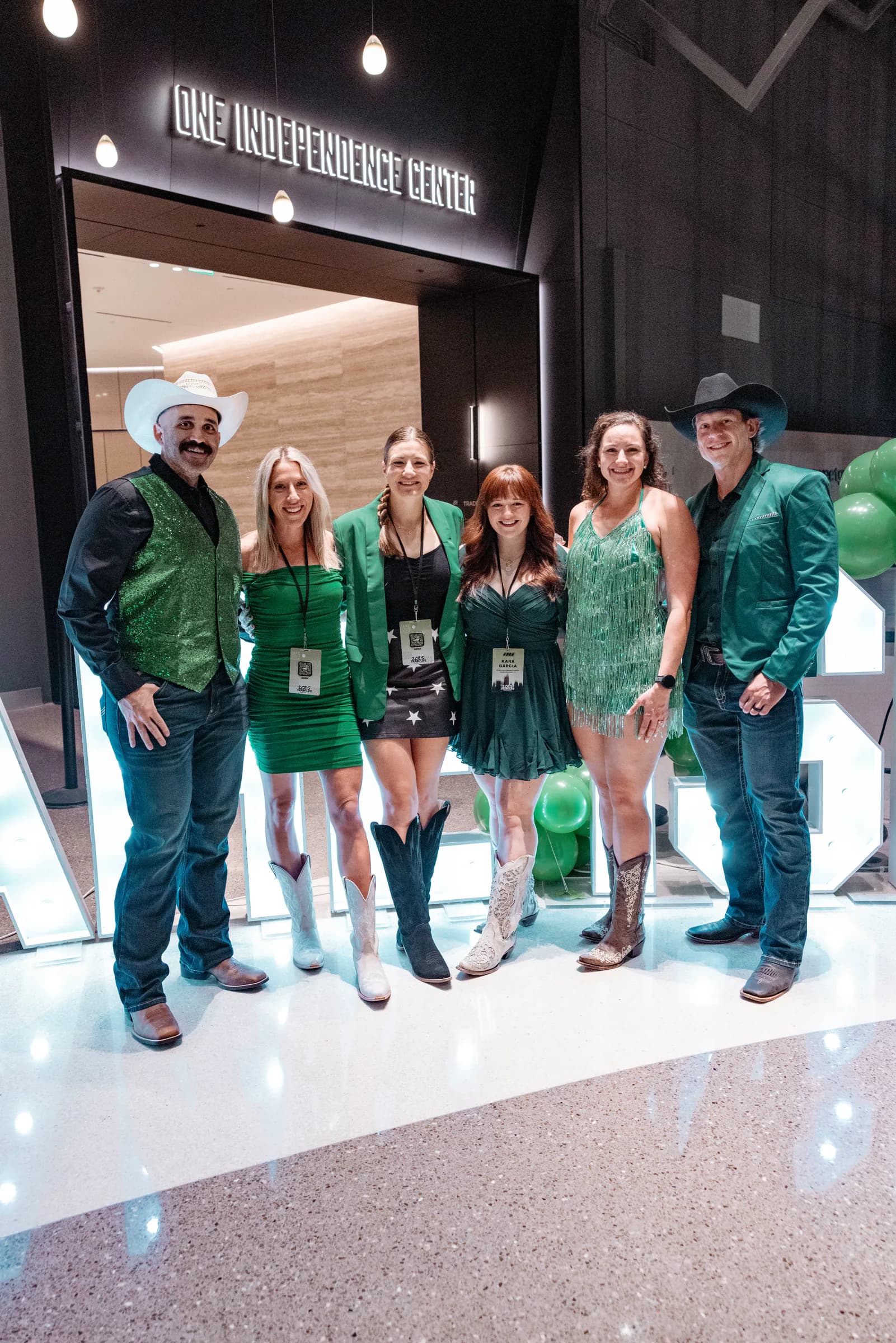 Owners Collective attendees wearing green and western attire