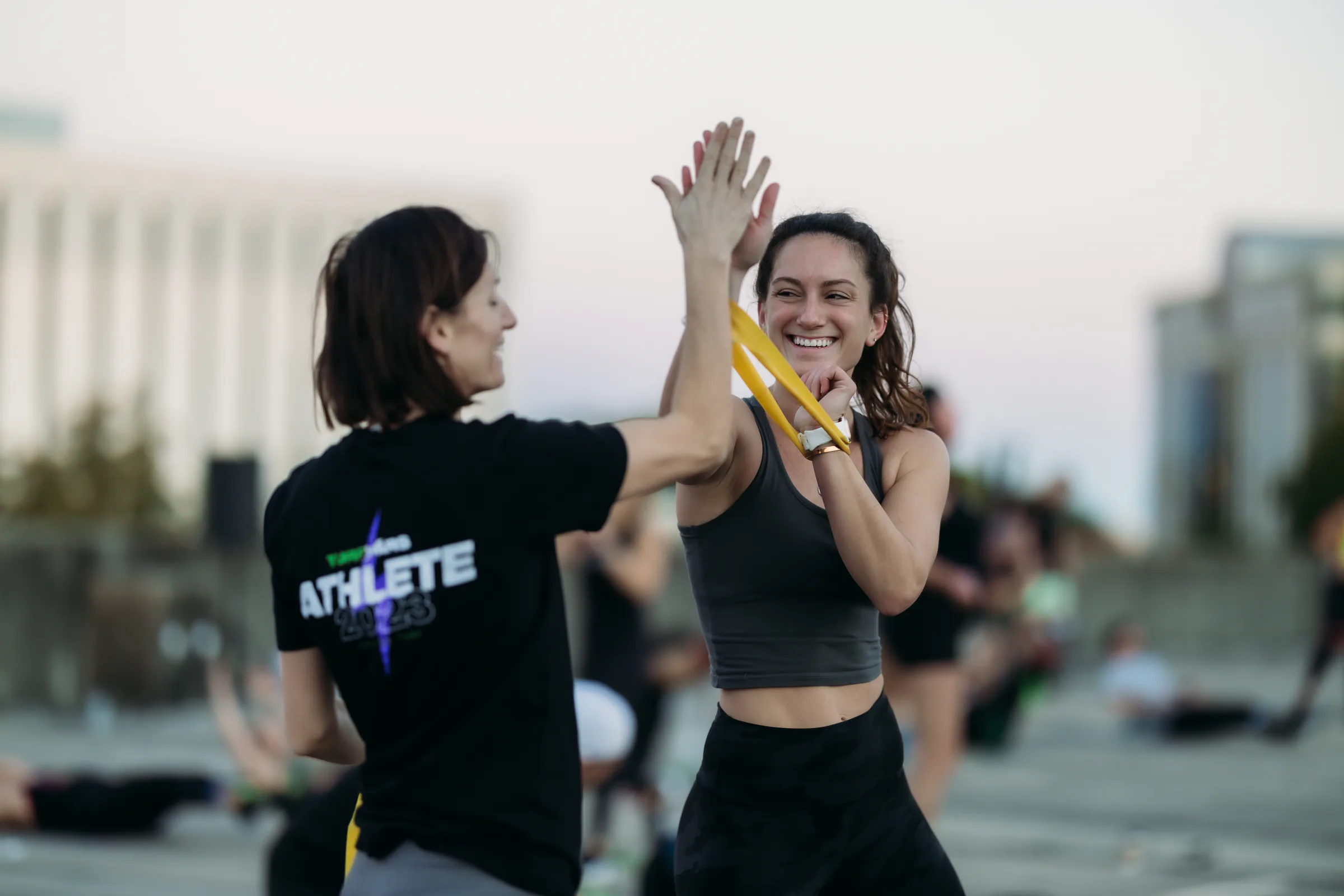 Convention workout participants celebrating with a high five