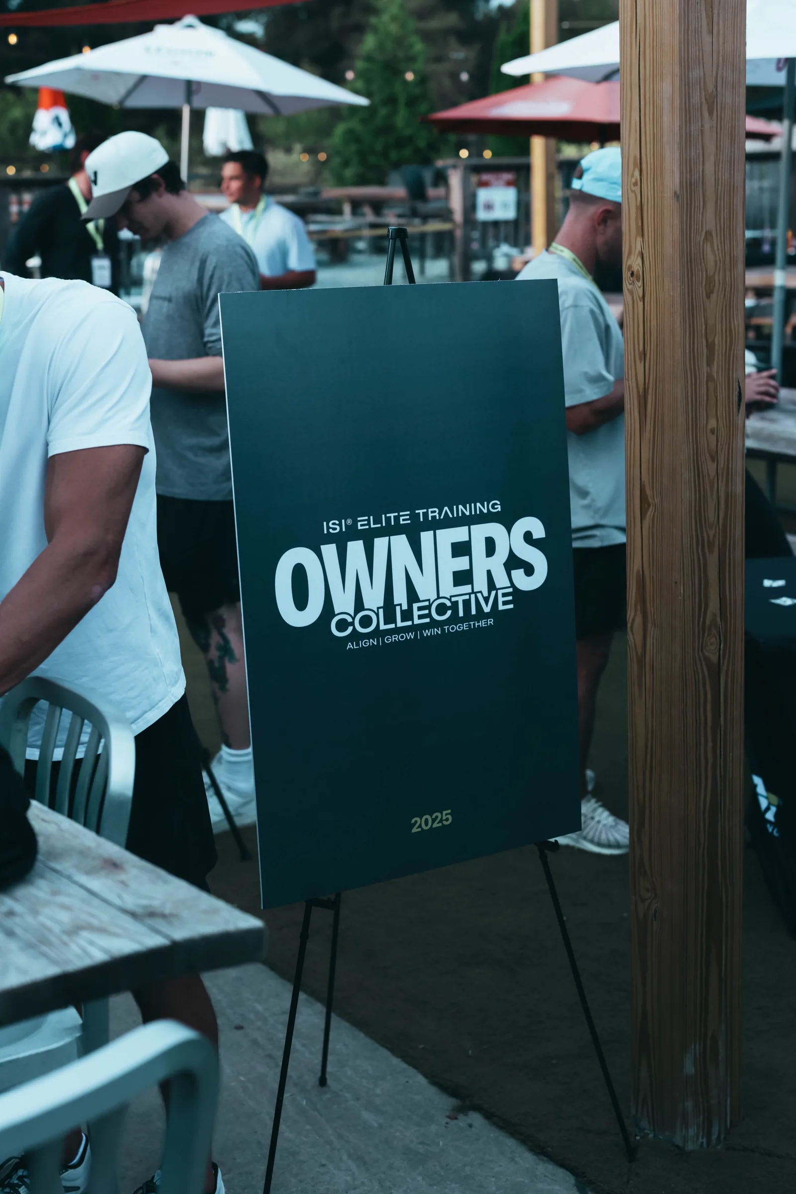 Owners Collective event sign held by an attendee