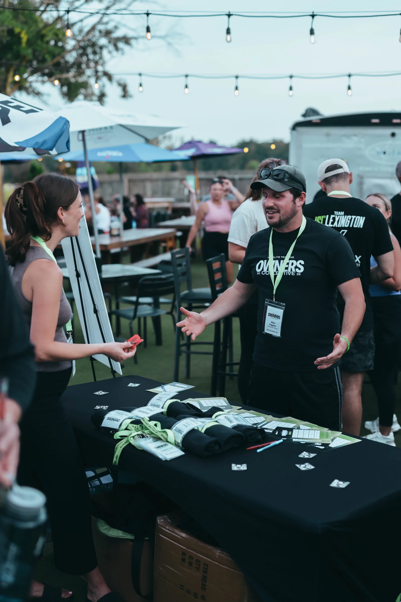 Owners Collective guest greeting an attendee